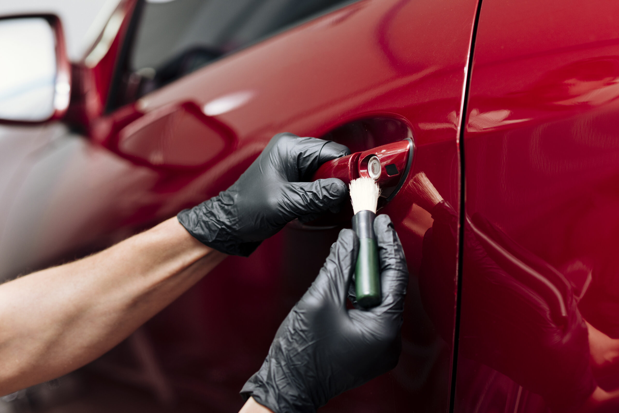 close up person cleaning car exterior scaled